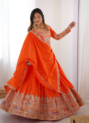 Amazing Party wear Orange Crepe Silk lehenga choli embellished with sequin coding work.